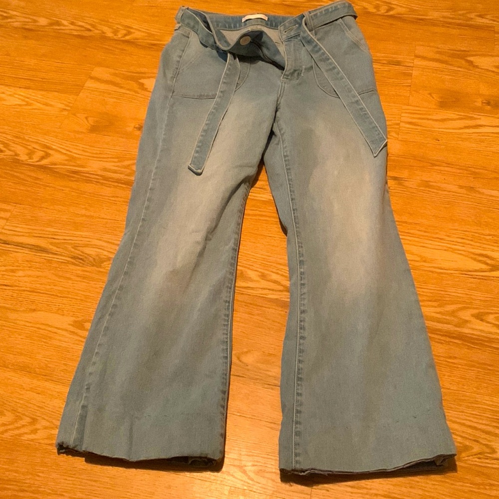 High rise flair jeans slight hole in front near zipper can be sewed